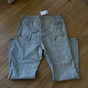 Denim flare low rise jeans with star decals on the back - NWT